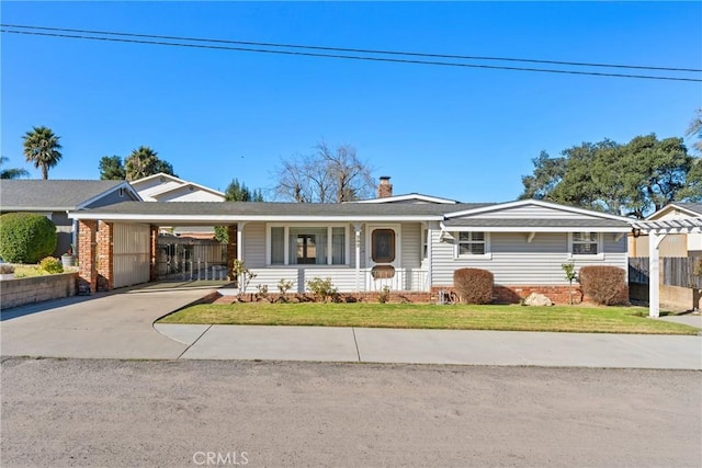 ranch-style home with a front lawn and a carport