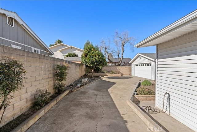 view of patio / terrace featuring a garage