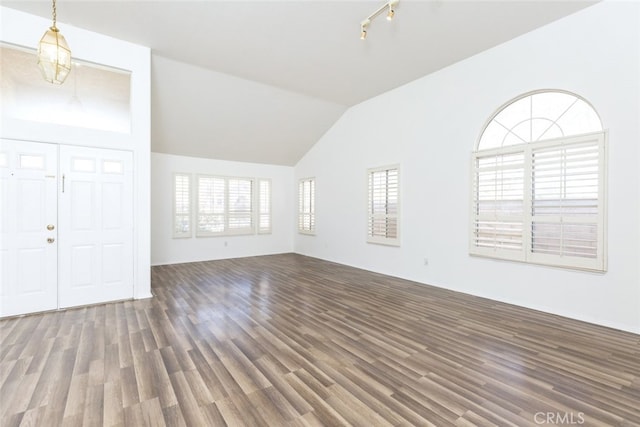 unfurnished living room with dark hardwood / wood-style floors and lofted ceiling