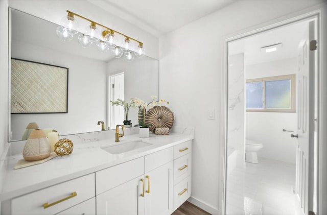 bathroom with vanity and toilet