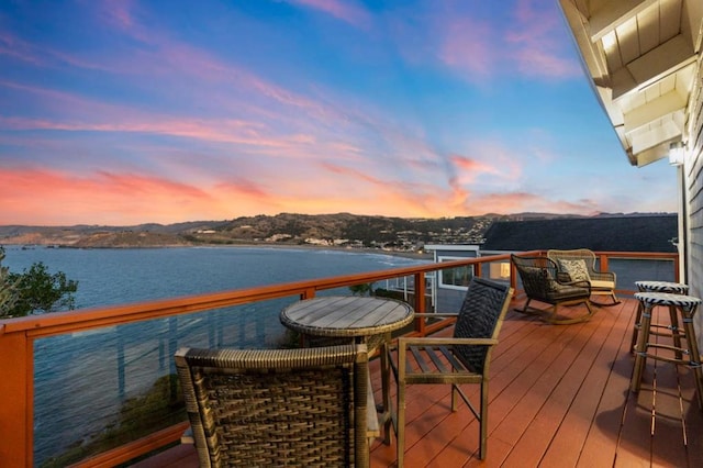 deck at dusk with a water view