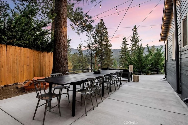 patio terrace at dusk with a mountain view