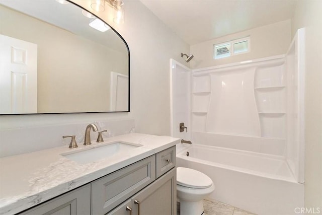 full bathroom with toilet, vanity, and  shower combination