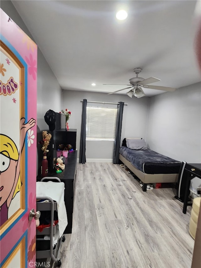 bedroom featuring ceiling fan and light wood-type flooring