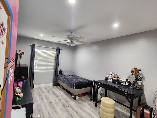 bedroom featuring ceiling fan and light hardwood / wood-style flooring