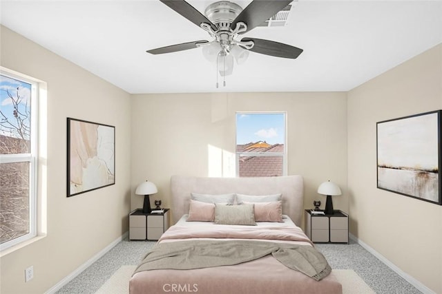 bedroom featuring ceiling fan and light carpet