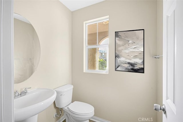 bathroom with sink and toilet