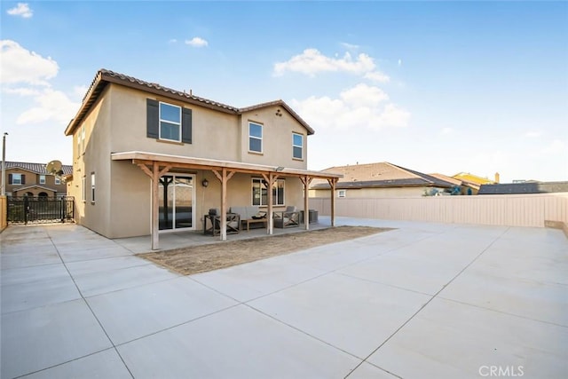 back of property featuring a patio area