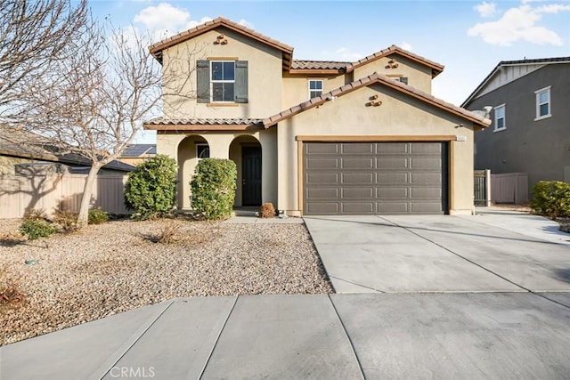 mediterranean / spanish-style house featuring a garage