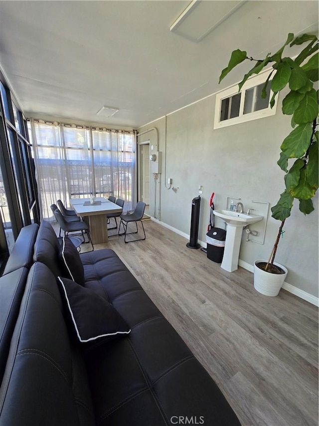 living room featuring sink and wood-type flooring