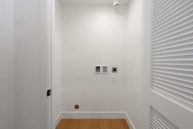 clothes washing area featuring washer hookup, hookup for an electric dryer, and hardwood / wood-style floors