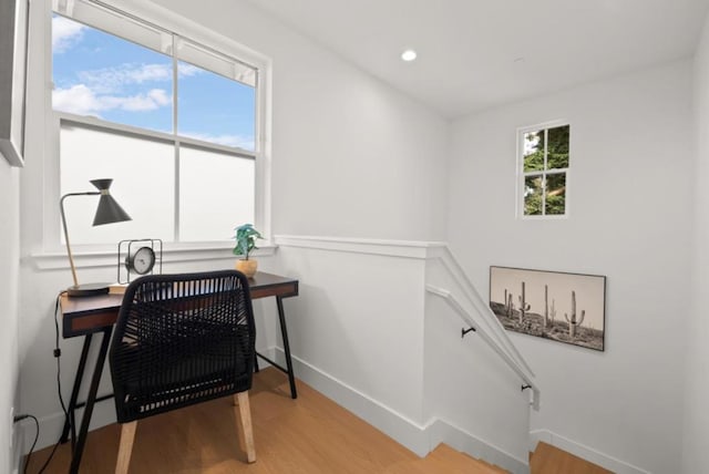 home office with hardwood / wood-style floors