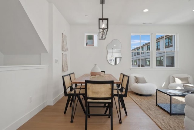 dining space with light wood-type flooring