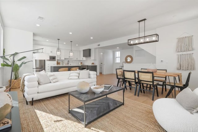 living room with light hardwood / wood-style flooring