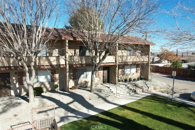 back of house with a garage