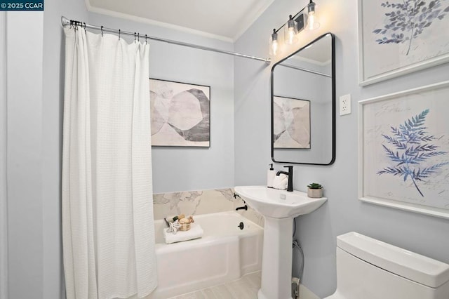 bathroom with ornamental molding, toilet, and shower / tub combo