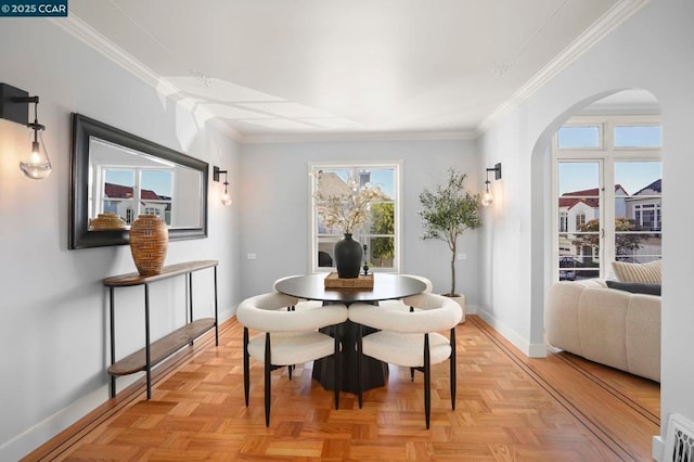 dining room featuring light parquet floors and ornamental molding