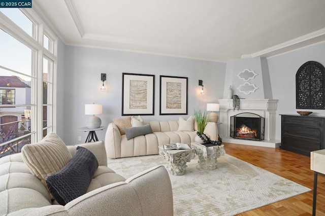 living room with parquet floors and crown molding