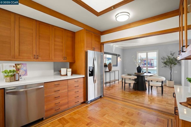 kitchen with light parquet flooring and appliances with stainless steel finishes