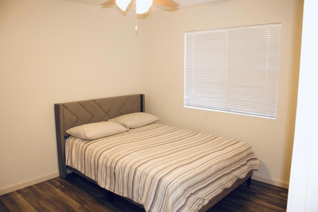 bedroom featuring ceiling fan and dark hardwood / wood-style floors