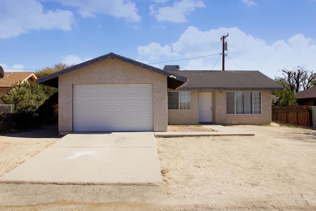 single story home with a garage