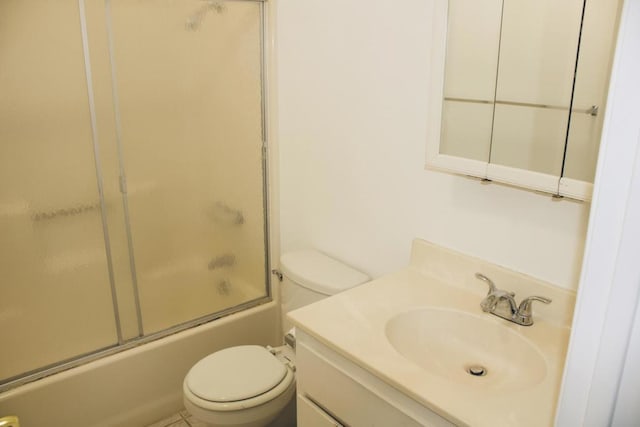 full bathroom with shower / bath combination with glass door, vanity, and toilet