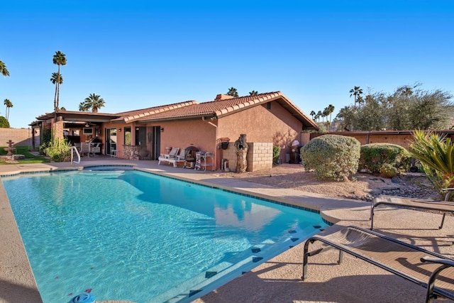 view of pool featuring a patio