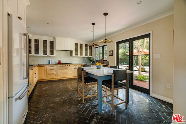 kitchen with crown molding, hanging light fixtures, backsplash, high end white fridge, and light brown cabinets