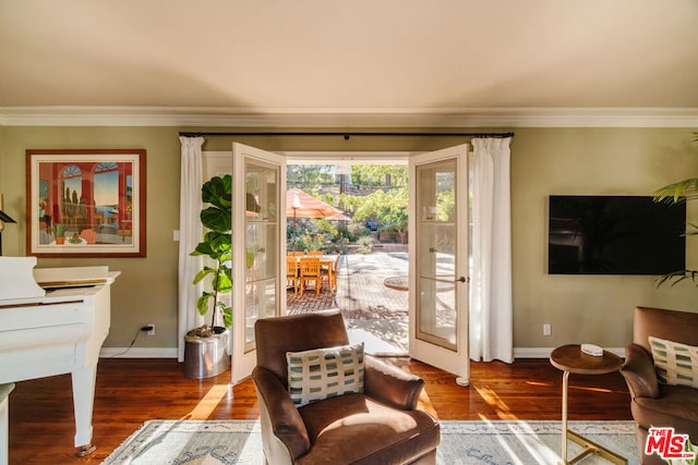 doorway featuring dark hardwood / wood-style flooring and crown molding