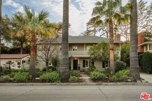 view of front of home with a balcony