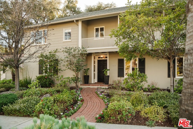 view of front of home with a balcony