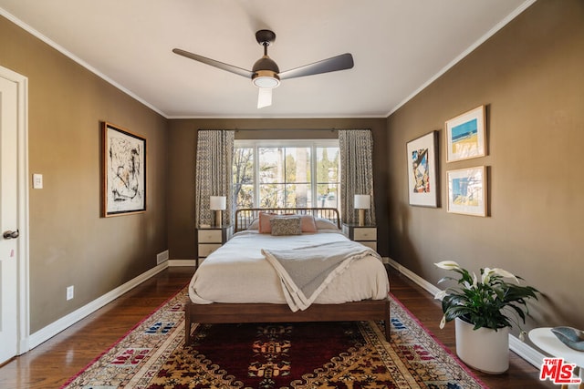 bedroom featuring wood-type flooring, ornamental molding, and ceiling fan