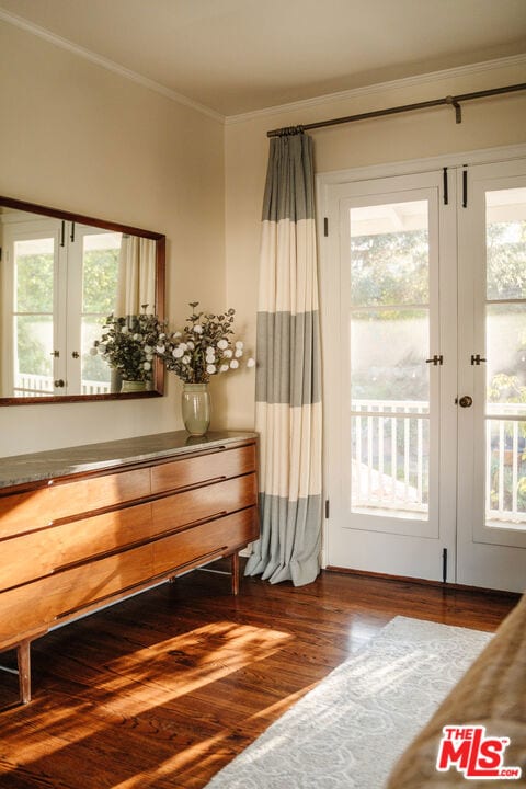 doorway to outside with french doors, ornamental molding, and hardwood / wood-style floors