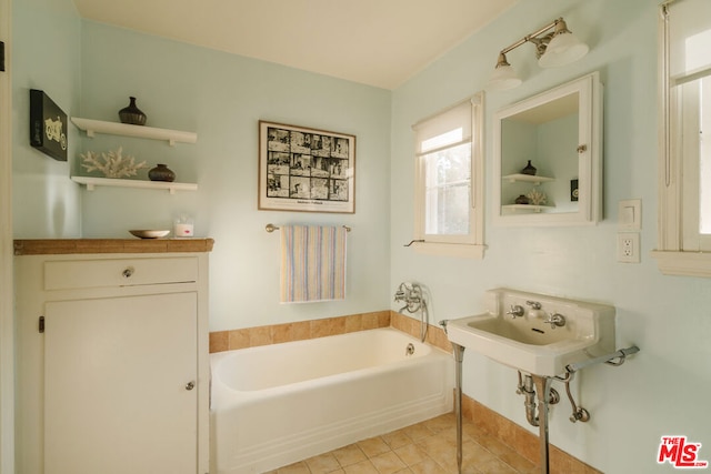 bathroom featuring tile patterned floors and a bathing tub