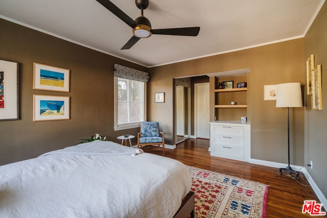 bedroom with ornamental molding, dark wood-type flooring, and ceiling fan