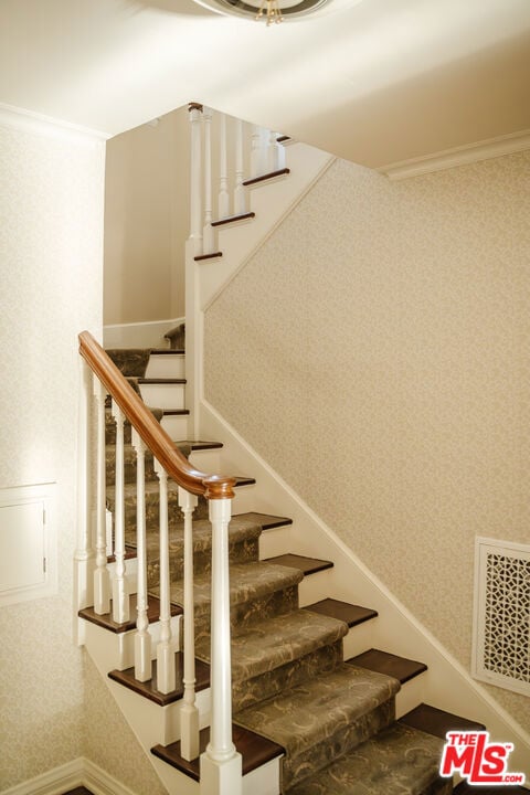 stairs with crown molding