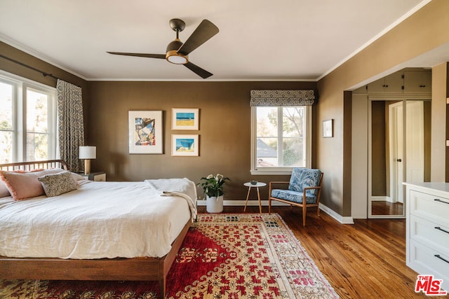 bedroom featuring ceiling fan, ornamental molding, and hardwood / wood-style floors