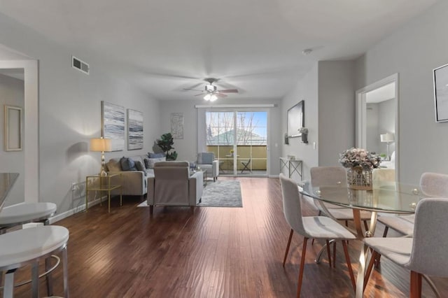 dining area with dark hardwood / wood-style floors and ceiling fan