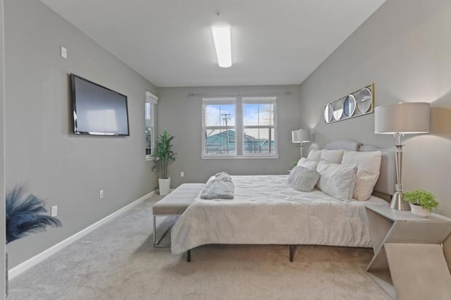 bedroom featuring light colored carpet