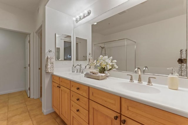 bathroom with vanity, tile patterned floors, and a shower with shower door