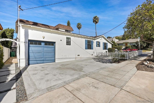 ranch-style house featuring a garage