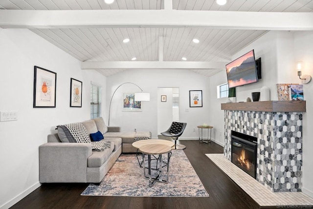 living room featuring a fireplace, dark hardwood / wood-style floors, and vaulted ceiling with beams