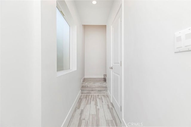 corridor featuring light hardwood / wood-style flooring