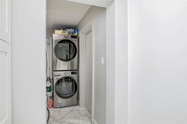 laundry area with stacked washing maching and dryer