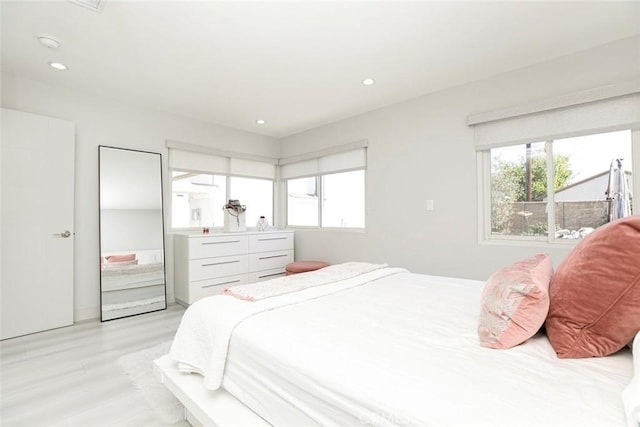 bedroom with light wood-type flooring