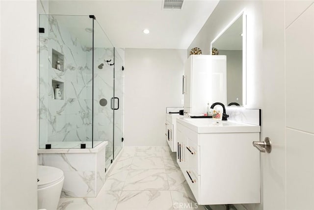 bathroom featuring vanity, toilet, and an enclosed shower