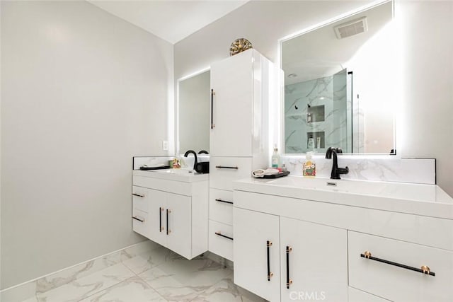 bathroom featuring an enclosed shower and vanity