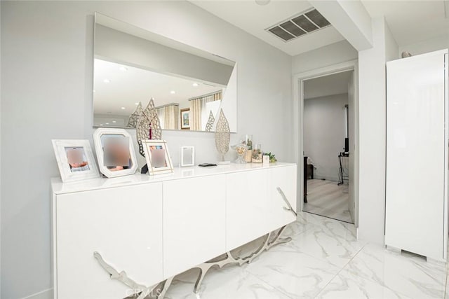 bar featuring white cabinetry