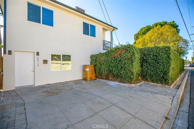 view of side of home with a garage