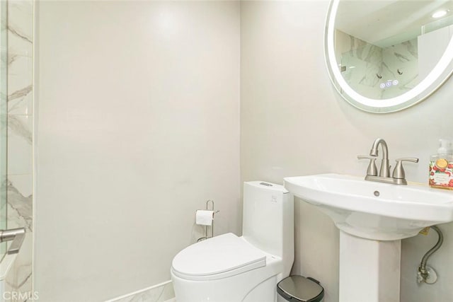 bathroom with sink and toilet